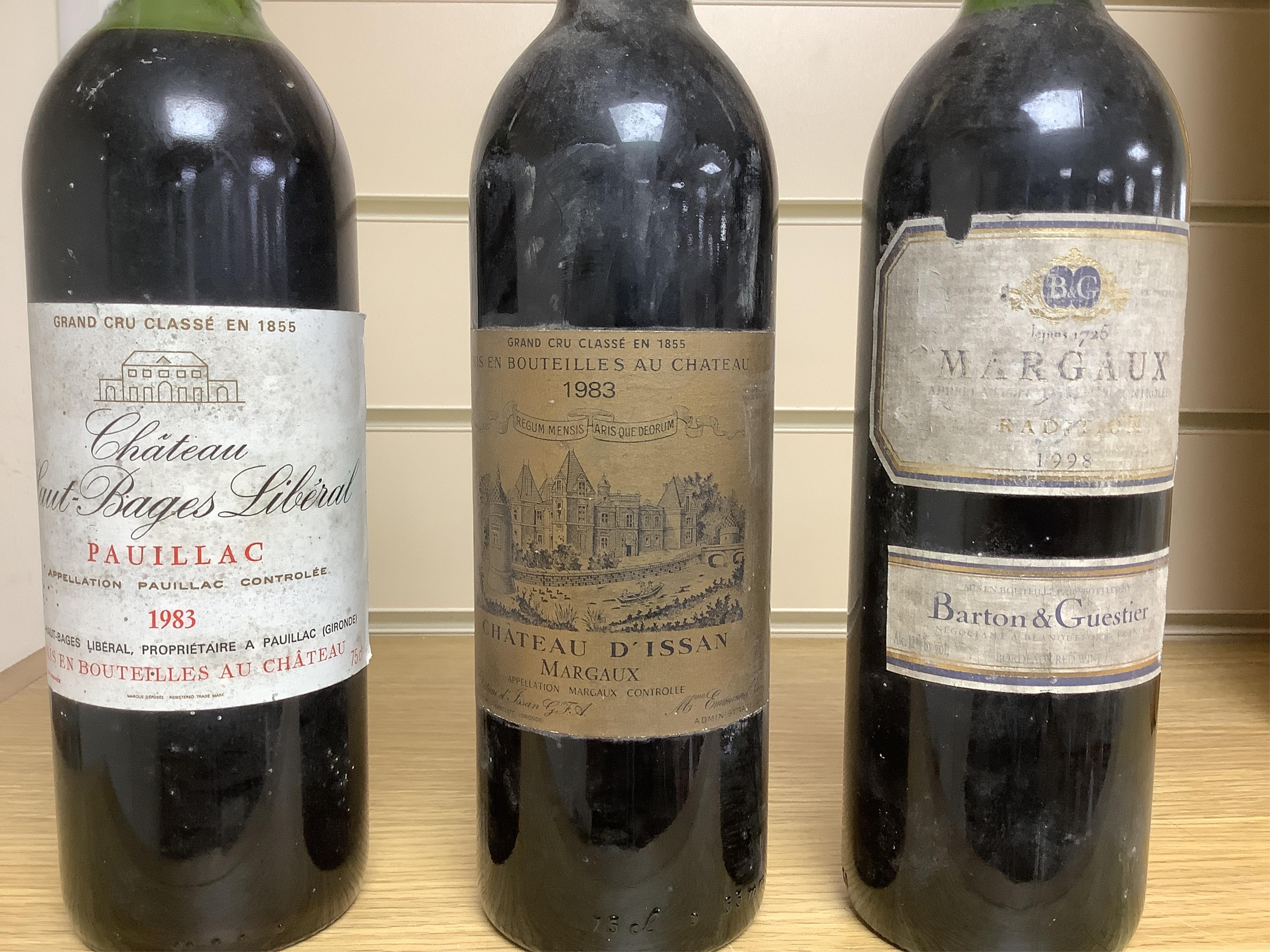 Three bottles of red wine: Chateau D’Issan Margaux 1983, Chateau Haut-Bages Liberal 1983 and Margaux 1998. Condition - good